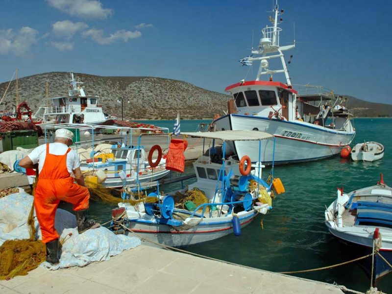 fisherman-organizing-nets-near-boat